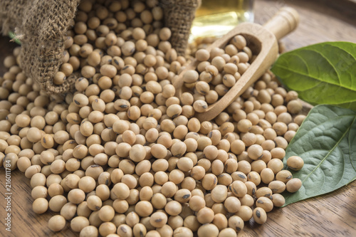 closeup is some soybeans with wooden spoon