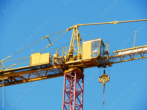 Wallpaper Mural Crane. Construction crane. Close up. Construction crane against blue sky. Torontodigital.ca