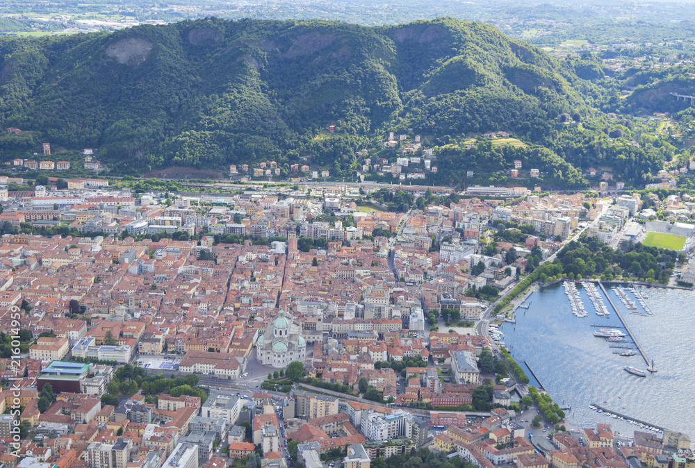 Aerial landscape of the picturesque colorful City of Como on Lake Como, Italy. Port of Como on a foreground