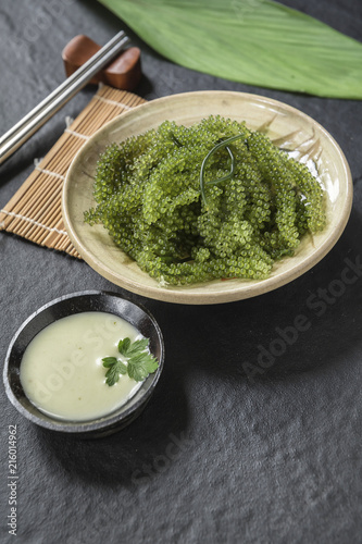 Umi-budou Seaweed or Green Caviar Healthy sea food or sea grapes seaweed on plate photo