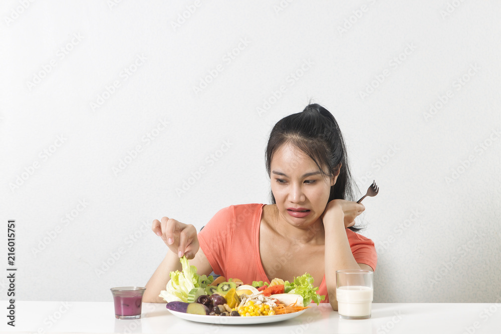  Woman does not like vegetable. Unhappy woman  does not like healthy food, Emotional face.