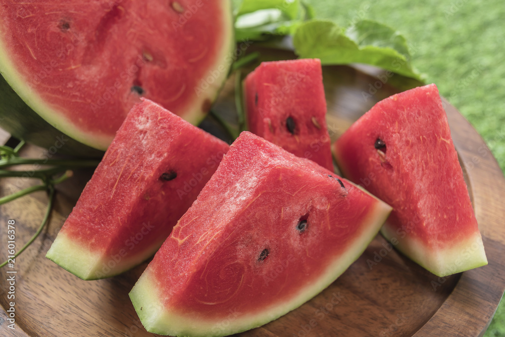 Fresh sliced watermelon wooden background Fresh sliced watermelon wooden background