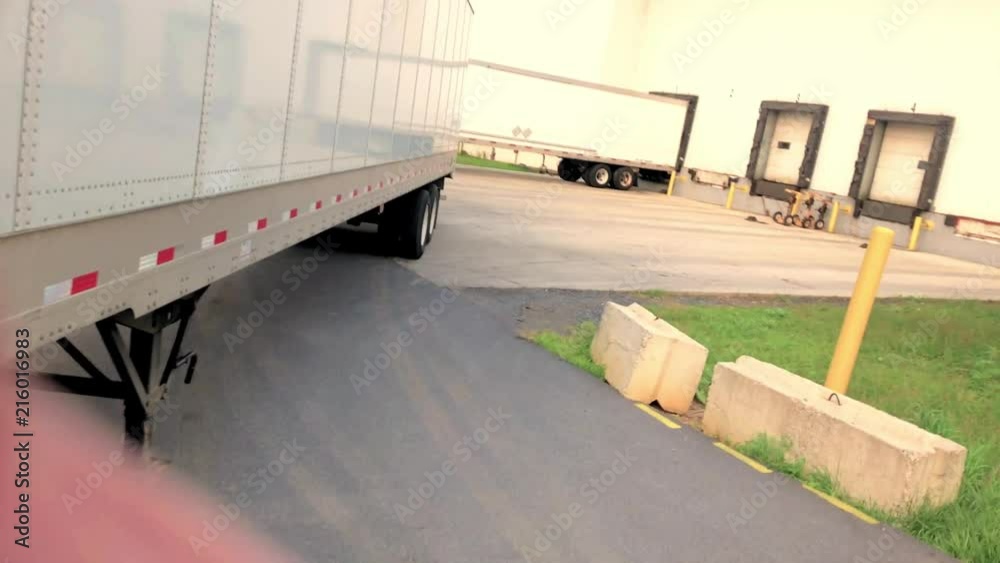 Backing trailer to dock door view from inside the truck