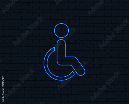 Neon light. Disabled sign icon. Human on wheelchair symbol. Handicapped invalid sign. Glowing graphic design. Brick wall. Vector
