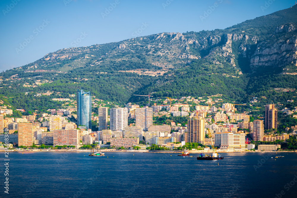 Monte Carlo, Monaco. Cityscape with skyscrapers and mountains along the coastline.