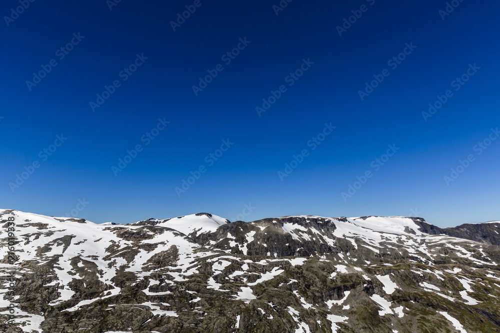 Snowy mountains against the blue sky