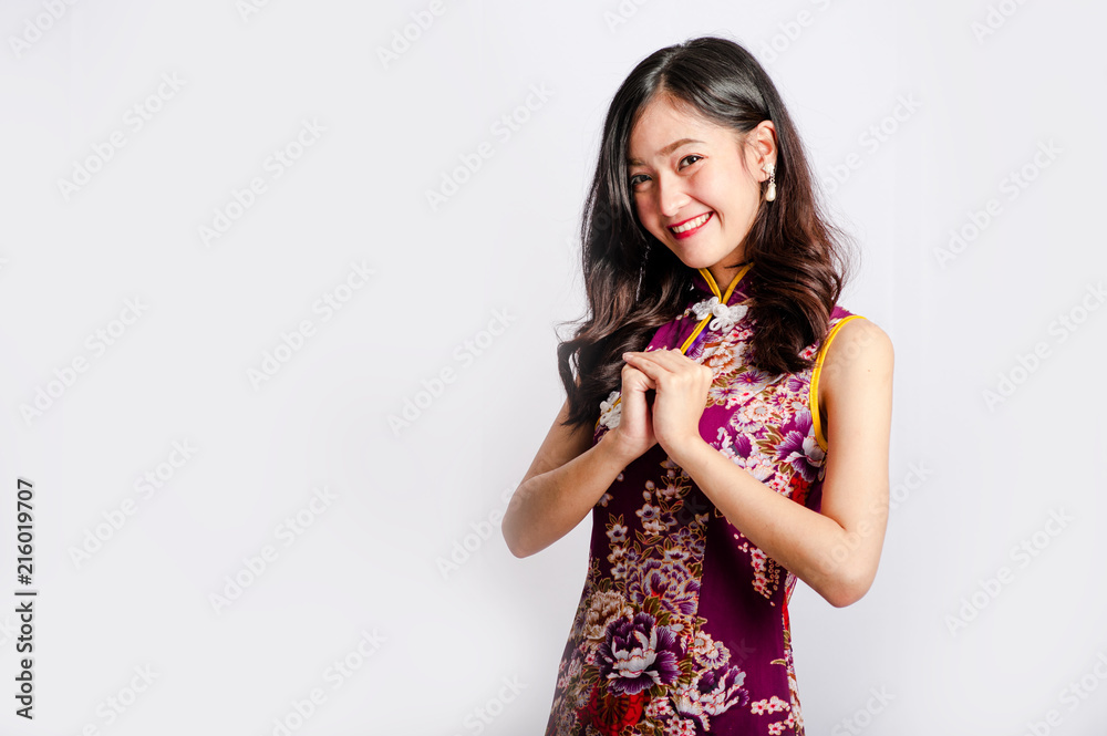 woman wear cheongsam in chinese new year.isolated on white background woman wear cheongsam in chinese new year.isolated on white background