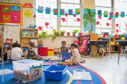 Students working in a kindergarten classroom.  photo