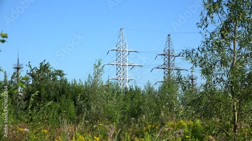 High voltage transmission power line at nature landscape. photo