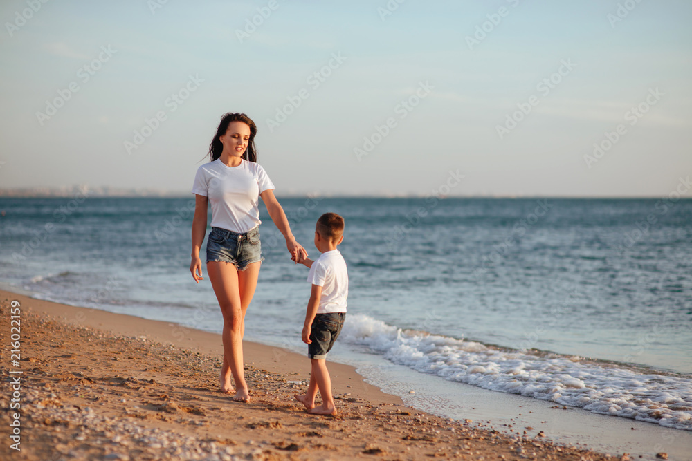Young mother with son in white T-shirts
