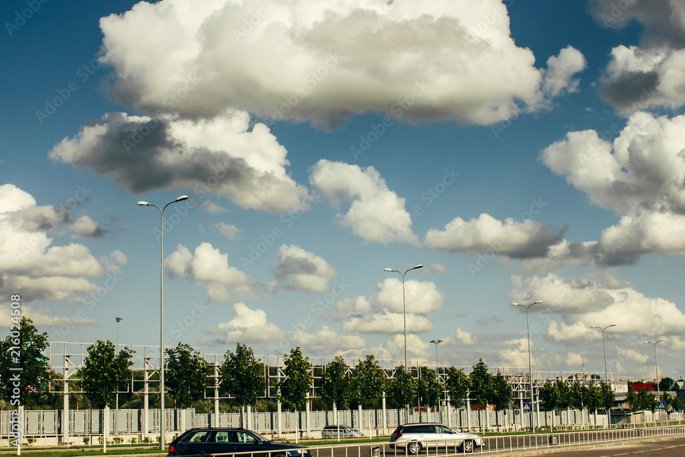 beautiful amazing view of sky and clouds on highway road near airport