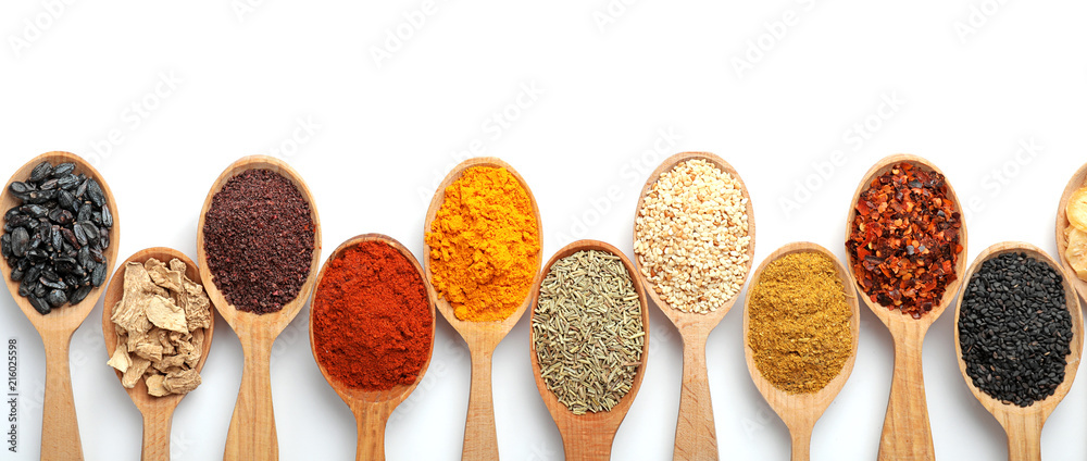 Composition with different aromatic spices in wooden spoons on white  background Stock Photo | Adobe Stock
