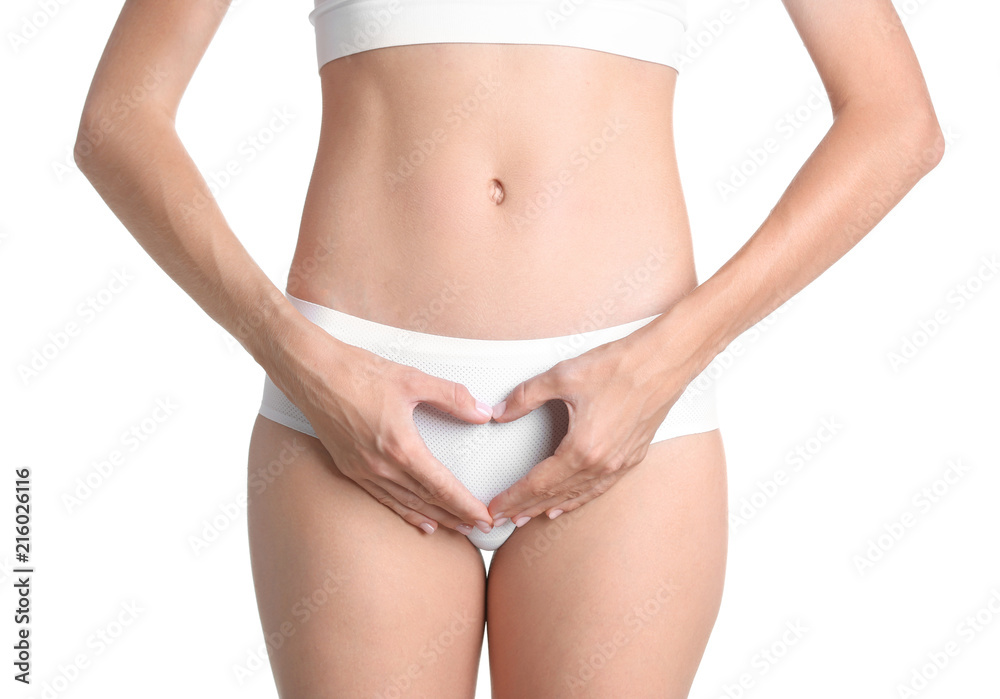 Young woman holding hands in heart shape on white background. Gynecology concept Young woman holding hands in heart shape on white background. Gynecology concept