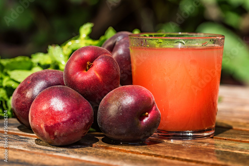 Fresh plum smoothie with plums close photo