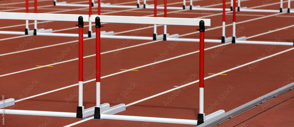 Hurdles on competition background