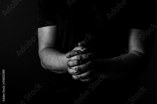 Folded Hands of a man. black and whit. Arms and hands
