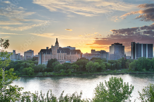 Sunset Over a River and City photo