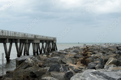 The fishing pier that parallels the jetty in Cocoa Beach  Florida. 