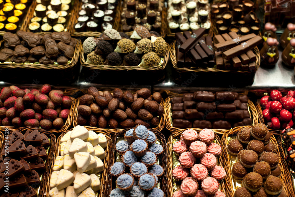 Famous sweet candy market .Confectionery at Boqueria market place in Barcelona, Spain. Assorted chocolate candy shop. Famous sweet candy market .Confectionery at Boqueria market place in Barcelona, Spain. Assorted chocolate candy shop.