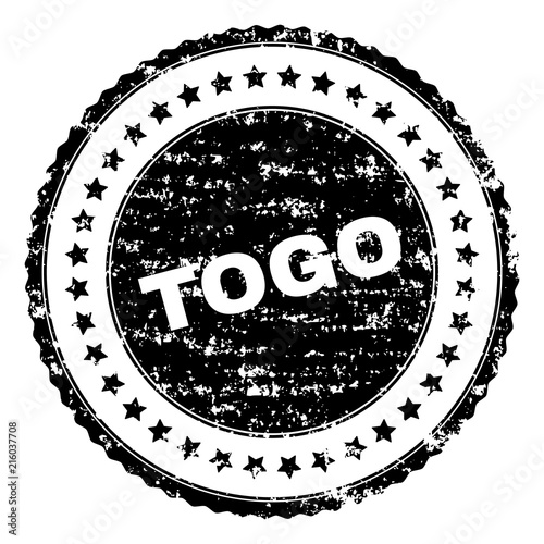 TOGO seal print with distress texture. Black vector rubber print of TOGO tag with dust texture. Rubber seal imitation has circle shape and contains stars.