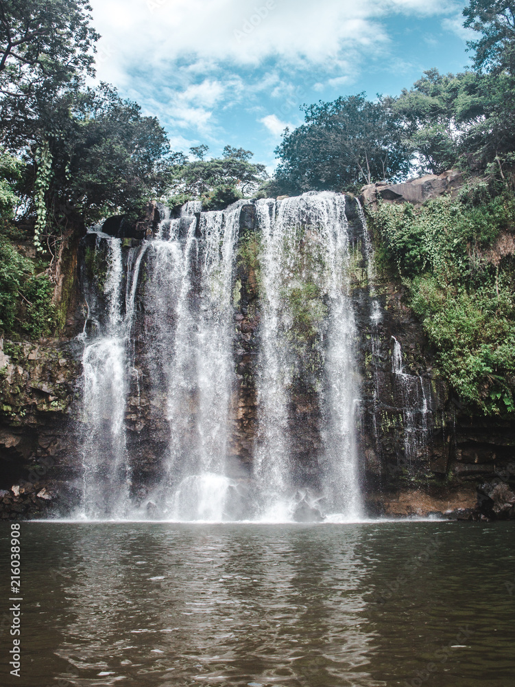 Llanos de Cortez waterfall in Bagaces, Costa Rica with heavy flow during rainy season