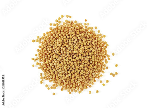 Pile of yellow mustard seeds isolated on white background. Top view.