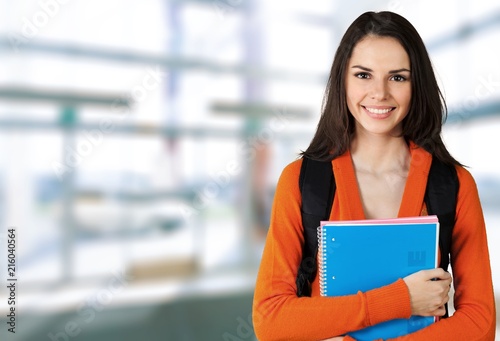 Young Female College Student on background