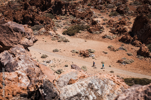 Family hiking in the volcanic environment of the Mount Teide National Park, Tenerife island