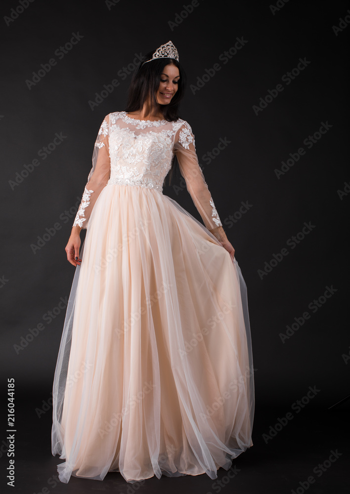 Full length of a beautiful bruenette woman in wedding dress Full length of a beautiful bruenette woman in wedding dress