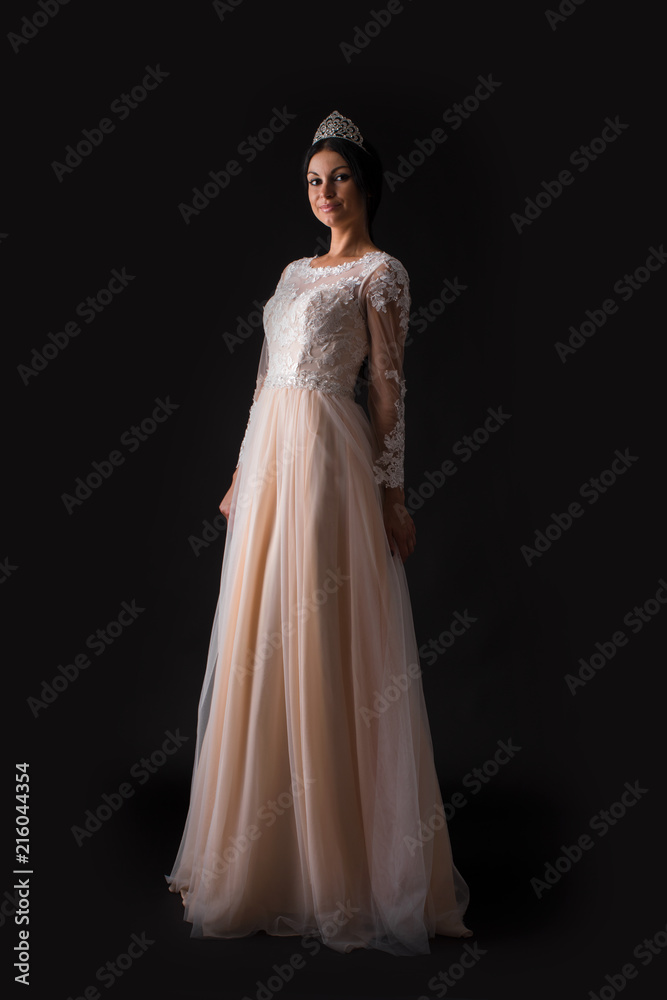  Full length of a beautiful bruenette woman in wedding dress