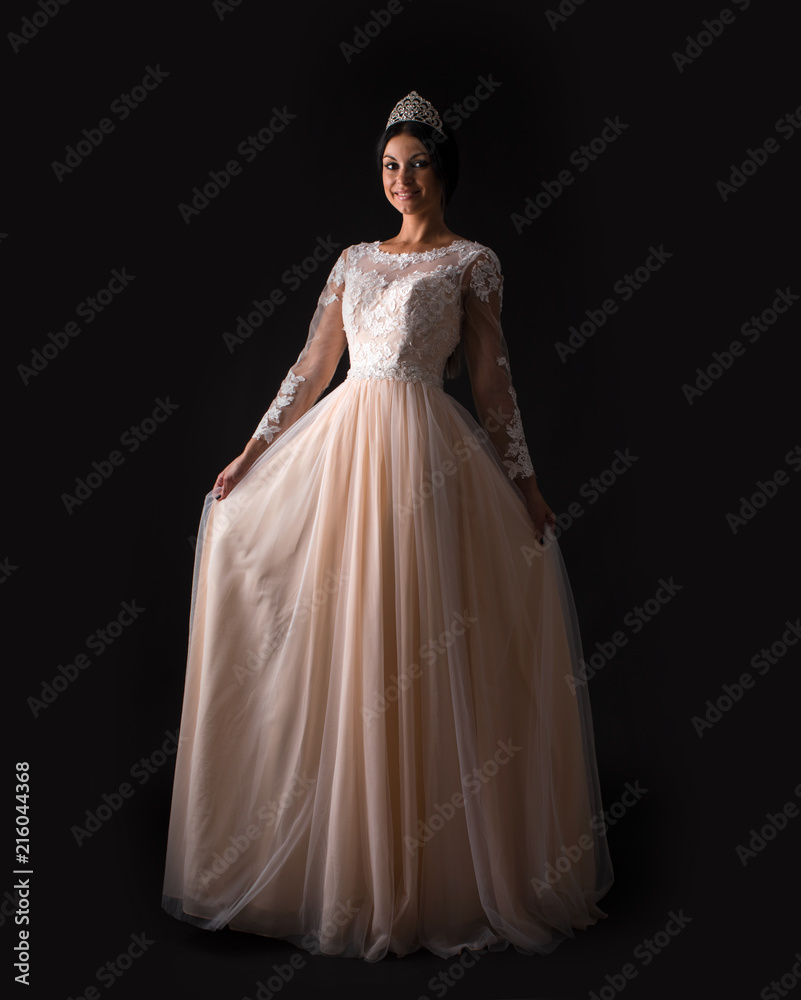 Full length of a beautiful bruenette woman in wedding dress Full length of a beautiful bruenette woman in wedding dress