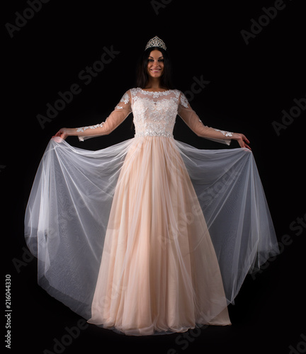  Full length of a beautiful bruenette woman in wedding dress