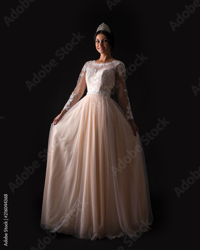  Full length of a beautiful bruenette woman in wedding dress