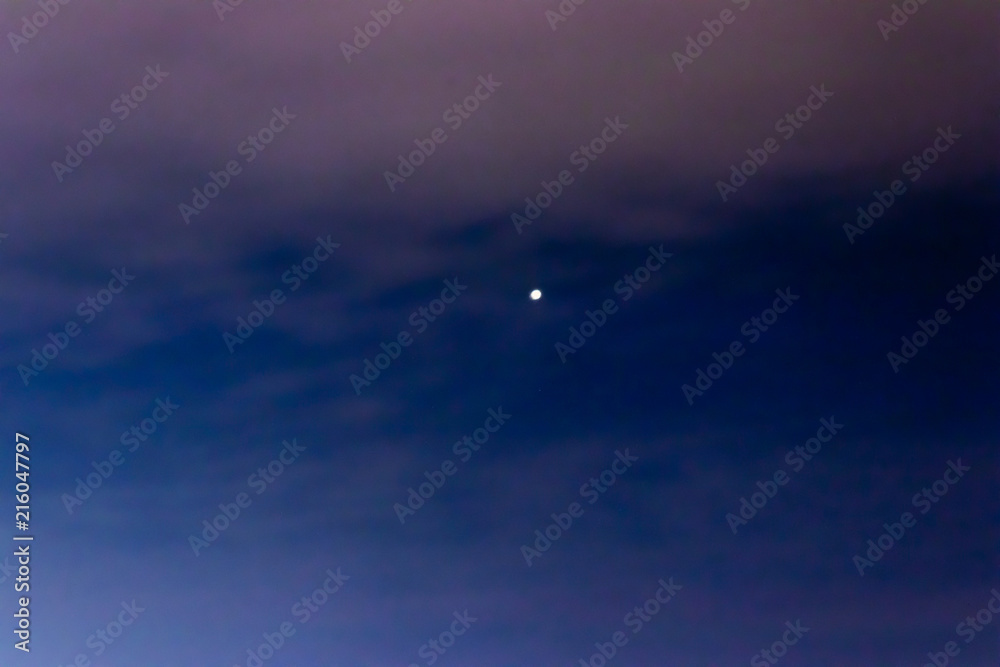 a night sky shoot with moon - dark blue and white colors are dominant a night sky shoot with moon - dark blue and white colors are dominant