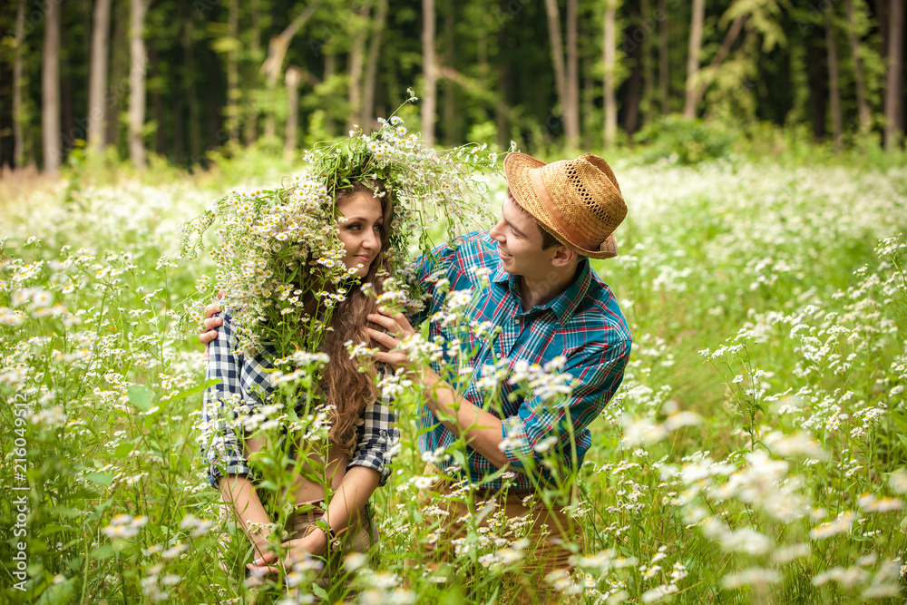 Fototapeta premium happy young couple in the woods