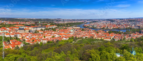 Skyline aerial view of Prague old town, Charles bridge, Prague Castle and St Vitus Cathedral and red roofs. Prague, Czech republic.