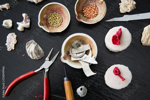 The process of moulding silver jewellery with natural objects like seashells with jeweller's wax