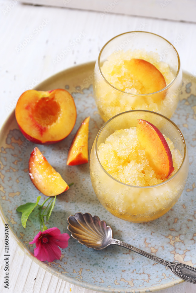 Peach granita and red fruits, frozen summer dessert Peach granita and red fruits, frozen summer dessert