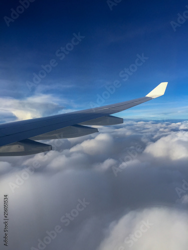 Airplane wing and clouds