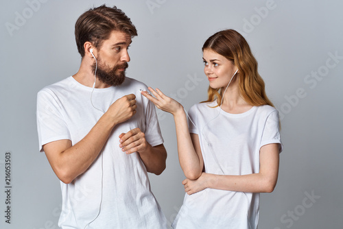 young couple in white t-shirts