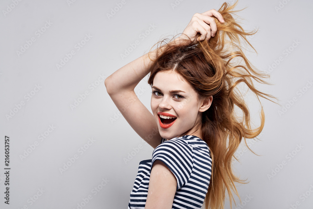 joyful woman holds her hair joyful woman holds her hair