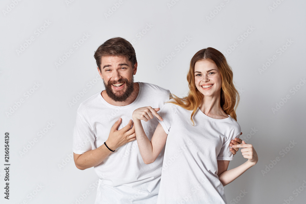 young couple in white t-shirts logo young couple in white t-shirts logo
