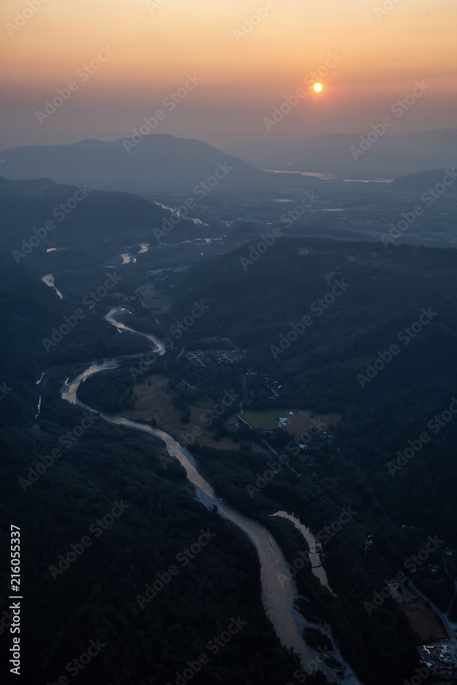 Aerial view of a river in the valley during smoke covered sky from forest fires. Taken in Chilliwack, East of Vancouver, BC, Canada. Aerial view of a river in the valley during smoke covered sky from forest fires. Taken in Chilliwack, East of Vancouver, BC, Canada.