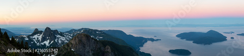 Panoramic landscape view of Howe Sound during a vibrant summer sunrise. Taken from the top of Brunswick Mountain, North of Vancouver, BC, Canada. © edb3_16