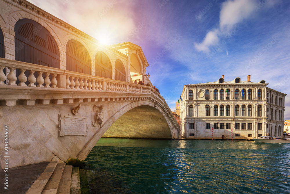 Rialto bridge in Venice, Italy. Venice Grand Canal. Architecture and landmarks of Venice. Venice postcard with Venice gondolas
