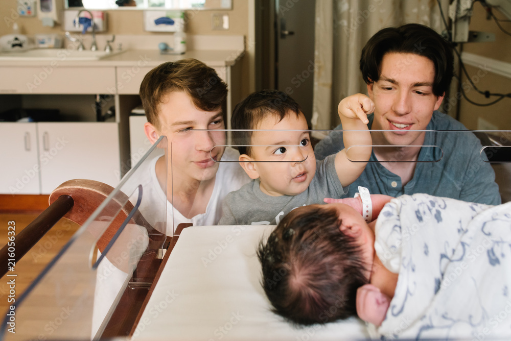 Stepbrothers bonding with newborn Stepbrothers bonding with newborn