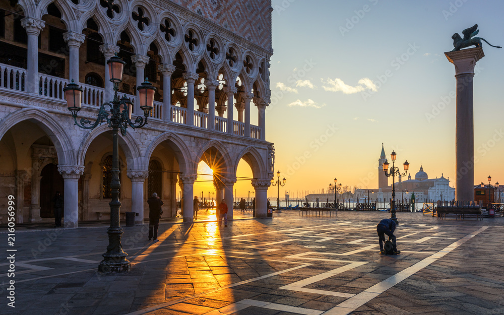 Fototapeta premium Sunrise in San Marco square, Venice, Italy. Venice Grand Canal. Architecture and landmarks of Venice. Venice postcard with Venice gondolas