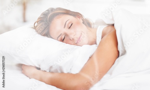 Young woman sleeping on the bad