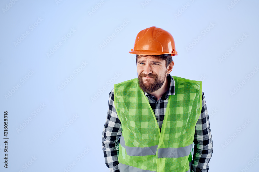 builder in an orange helmet with emotions on his face