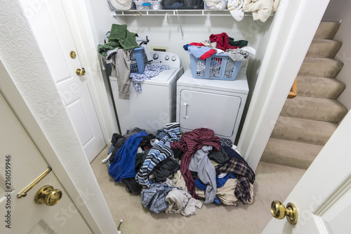 Cluttered messy laundry roo...